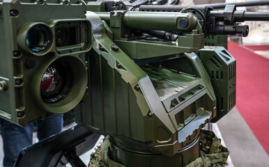 Heavy military gun cannon displayed on defence fair - closeup detail