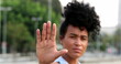 © Marco - Blackoman annoyed making stop sign with hand, saying no, expressing defense or restriction