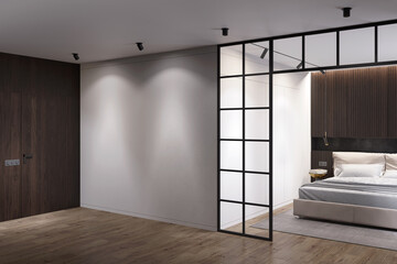 Dark modern interior with a gray wall illuminated by two spotlights, a dark wood door, a modern room divider, a bedroom with dark wood cabinets over a beige bed, a  closet in the background. 3d render