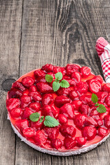 Wall Mural - Delicious strawberry tart on wooden background