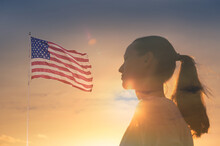 Strong Woman Facing The Suns Sky Standing Next To American Flag 