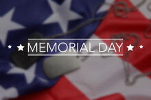 Text MEMORIAL DAY On Blurred USA Flag