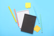 © Pixel-Shot - Notebooks, felt-tip pens and sticky note papers on color background