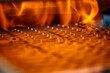 Leinwandbild Motiv Annealing powdered details with burning flame in furnace