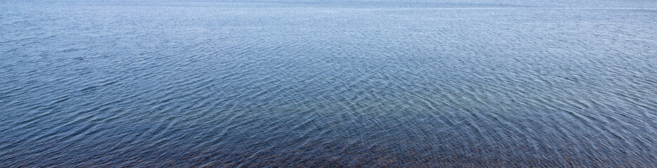 Wall Mural - texture of surface of blue water - sea background	