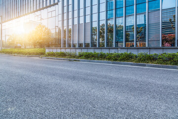 city empty traffic road with cityscape in background