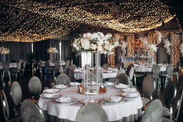 round served table with a large central flower arrangement in the banquet hall