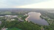Wolfsburg, Germany: Aerial view of city in Lower Saxony, lake Allersee in morning - landscape panorama of Europe from above