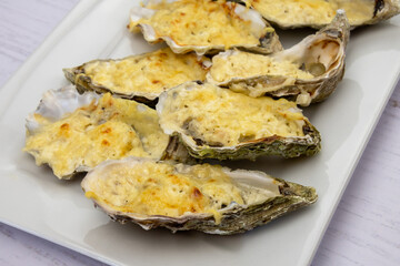 Wall Mural - Baked oysters with cheese in a dish