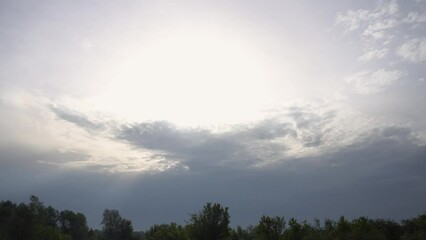 Wall Mural - blue sky background with white clouds in sunlight
