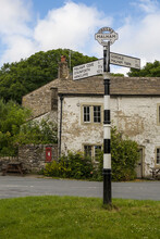 Signpost On The Village Green: Malham, Yorkshire Dales, North Yorkshire, England