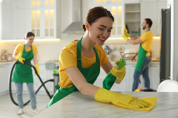 Wall Mural - Team of professional janitors working in kitchen