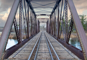 Canvas Print - Old iron railway truss bridge built in 1893 crossing the Mississippi river in spring in Galetta, Ontario, Canada