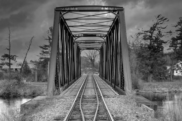 Wall Mural - Old iron railway truss bridge built in 1893 crossing the Mississippi river in spring in Galetta, Ontario, Canada