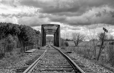 Wall Mural - Old iron railway truss bridge built in 1893 crossing the Mississippi river in spring in Galetta, Ontario, Canada