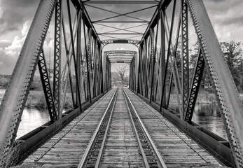 Canvas Print - Old iron railway truss bridge built in 1893 crossing the Mississippi river in spring in Galetta, Ontario, Canada