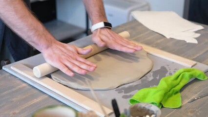 Wall Mural - Creating handicraft pottery: closeup of working table in ceramics studio 