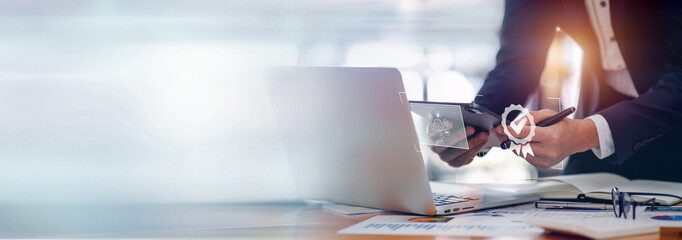 Document Businessman working modern computer Document Management System (DMS), Virtual online documentation database and process automation to efficiently manage files,