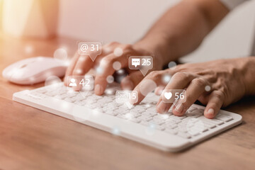 Wall Mural - technology concept social media man using computer access online media Through the Internet, there is marketing to answer customer chats. by working at home