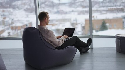 Sticker - Professional successful man in modern office. Confident business man working with phone.