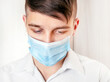 © Sabphoto - Sad Man in Flu Mask
