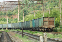 Old Multicolored Freight Cars At The Marshalling Yard In The Summertime