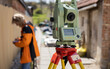 Surveyor measures real estate with a digital surveying device