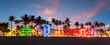 Leinwandbild Motiv Miami Beach Ocean Drive panorama with hotels and restaurants at sunset. City skyline with palm trees at night. Art deco nightlife on South beach