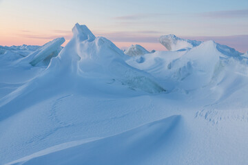 Wall Mural - winter arctic landscape. view of snow and ice at sunset. ice hummocks on the frozen sea in the arcti