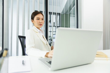 Confidence woman concept, Businesswoman read financial data on laptop to analyzing business plan