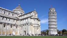 Europe, Italy , Pisa, Tuscany , April 2022 - Pisa Tower In Piazza Dei Miracoli Duomo Cathedral, Marble Statue And Leaning Tower With Tourists After Finish Of Covid-19 Coronavirus 