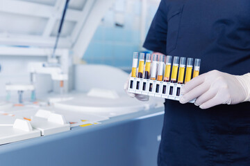 Wall Mural - medical scientist loading samples in robot machine for biochemical automatic testing blood laborator