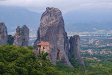 View Of Monastery Of Rousanou On Top Of A Sheer Cliff. The Miracle Of Meteora - Harmony Of Man And Nature In Greece. A Popular Travel And Pilgrimage Destination