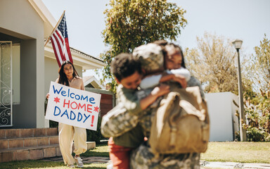 Canvas Print - Soldier receiving a warm welcome from his family