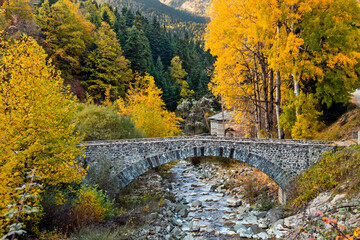 The old stone arched Katouna bridge in Krania village, Aspropotamos region, Trikala, Thessaly, Greece.