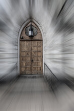 Gothic Style Door To A Stone Church With Motion Blur And Desaturated Look