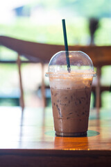 Wall Mural - Iced coffee in a plastic cup.