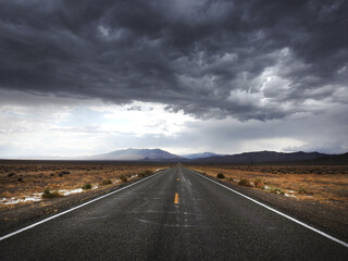 Storm clouds looming over the remote desert, above State Highway 266.  A desolate route of vast wilderness that takes you across the Nevada - California Border. 