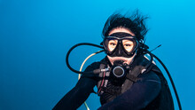 Diver Exploring The Tropical Waters Around Koh Tao In Thailand