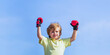 © Yevhen - Little boy doing boxing exercise. Children boxing. Little boy sportsman at boxing training. Sports man, boxing little boy in red boxing gloves