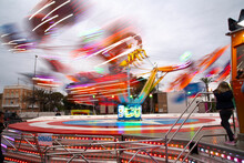 Hilarious Fairground Attractions, With Lights Of Different Colors Blurred By Movement
