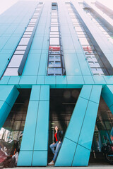 modern business center with columns and girl in stylish urban ou