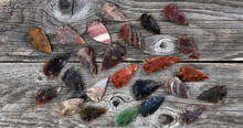 Native American Arrowheads On Rustic Wood Surface For A Vintage Concept