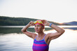 © Halfpoint - Portrait of active senior woman swimmer outdoors by lake.