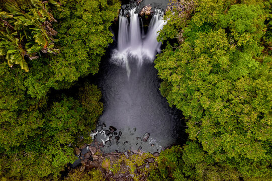 aerial long exposure view of leon waterfall (cascade leon) which is hidden in a forest located in th