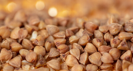 Wall Mural - Close-up of buckwheat groats as background.