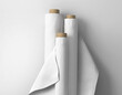 © PIXPINE - Three large blank white empty plain fabric bolts standing against white isolated background