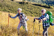 © pucko_ns - Active old woman and man walking at field and enjoy