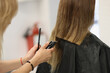 © H_Ko - Process of hair cutting at beauty salon, using hair clipper