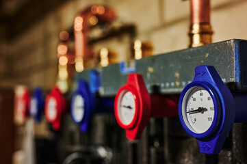 Heating system under construction with a view to the thermometers of the heating circuits.